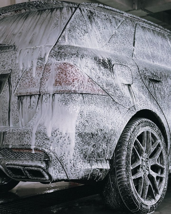 Silver Wash detailing a car in a customer's driveway in Frankston